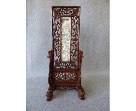 Chinese hardwood stand, with central ivory panel depicting Chinese figures in landscape