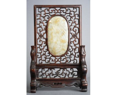 C19th Chinese oval jade plaque mounted on a wood table screen, carved with finger citron and foliage, 22cm high. 