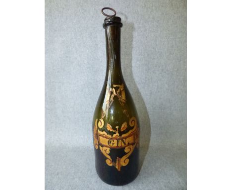 Antique champagne bottle with later gilt decoration as a gin decanter