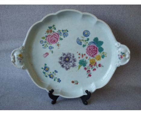 C18th Chinese porcelain famille rose tea service tray of lobed oval form, painted with floral spray, 47cm wide