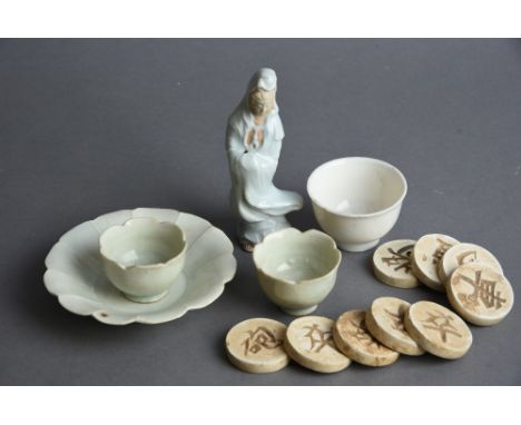 Mixed lot including two Chinese ‘yingqing’ tea bowls and one saucer, a pale blue-glazed figure of Guanyin, a dehua cup, and a