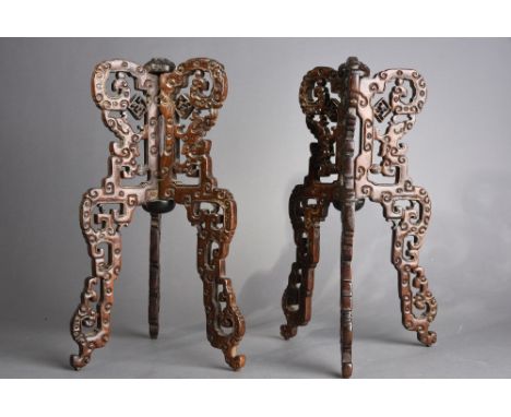 Pair of C18th/19th Chinese nanmu folding hat stands, each pierced and carved with kuilong connecting to a ‘ruyi and Shou’ fin