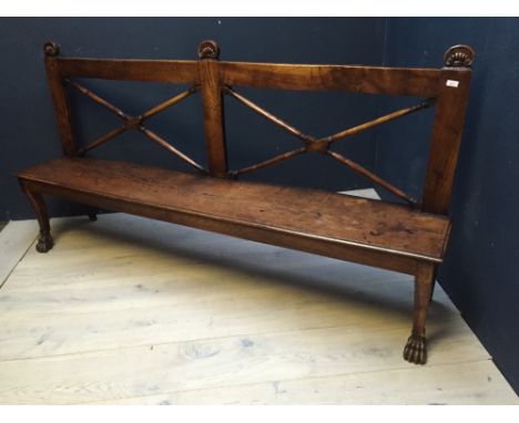 George III Irish elm bench, the back with X framed turned supports & shell finials over a planked seat on shallow sabre legs 