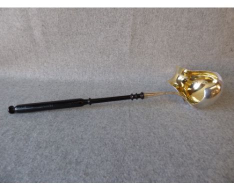 Early C19th East European silver punch ladle with gilt lined boat shaped bowl and turned ebony handle 