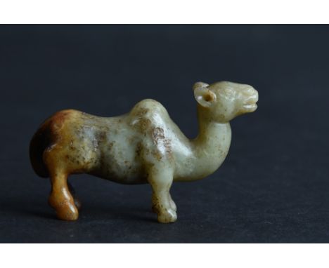 Chinese greenish-yellow and russet jade carving of a cameo, Tang Dynasty or later, 5.5cm long. 