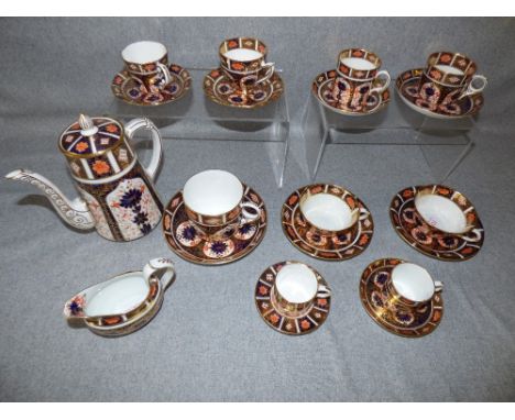 Collection of Royal Crown Derby tea cups, coffee cups and saucers (20's-30's)and a teapot and cover, 1928 & milk jug 1918