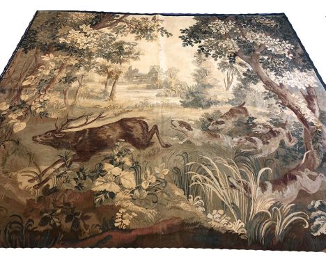 19th CENTURY VERDURE TAPESTRY, 296cm x 265cm, depicting a deer hunt in a woodland. 