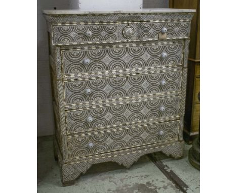 SYRIAN COMMODE, 19th century, mother of pearl, bone and metal inset with white marble top above five long profusely set drawe