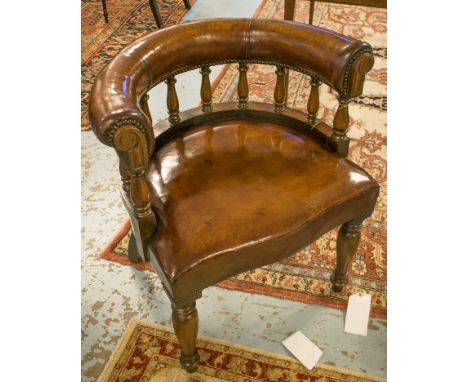 LIBRARY DESK CHAIRS, a pair, vintage mahogany hand finished brass studded leaf brown leather with bow back and turned front s