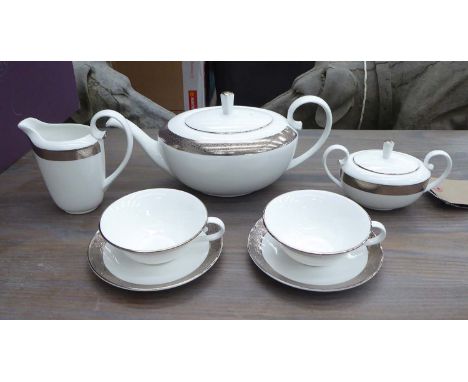 ASPREY TEA FOR TWO SET, boxed swirl pattern, tea pot, milk jug, sugar bowl, plus a pair of cups and saucers. (7)