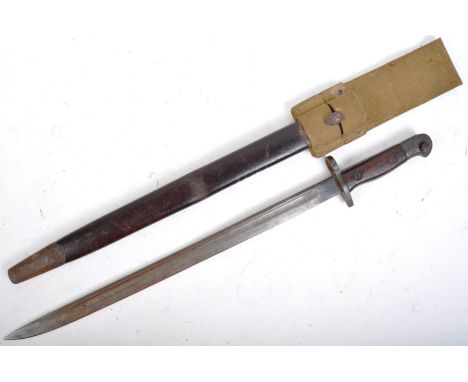 A WWI First World War British 1907 pattern rifle bayonet. Hooked pommel with press release stud, wooden grips, with ring cros