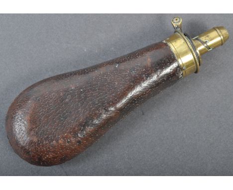 An antique 19th century Bartram &amp; Co made brass musket powder shot flask. Impressed maker's marks to nozzle, with origina