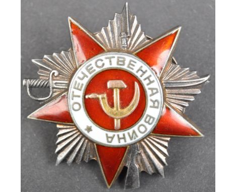 An original WWII Second World War issue Russian Soviet ' Order Of The Patriotic War ' medal. Usual form with red and white en