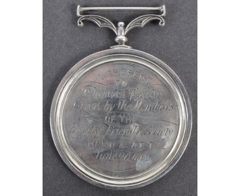 Collection of antique medallions - a vintage hallmarked silver medallion from the Ewerby Friendly Society awarded to one Thom