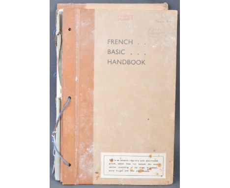 A scarce original WWII Second World War ' French Basic Handbook ' marked ' Secret ' and dated January 1944. The manual filled