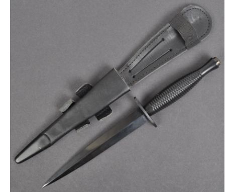 An original current issue Fairbairn Sykes FS British commando knife dagger. The knife having a disc shaped pommel, ribbed han