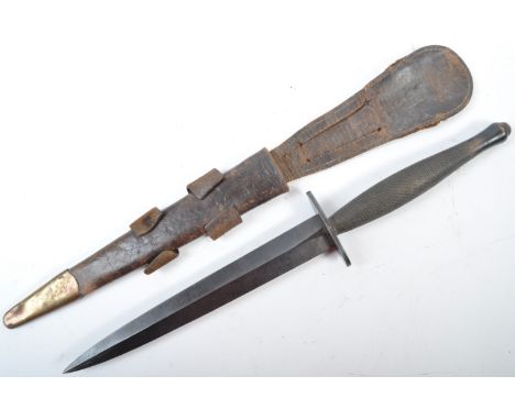 An original WWII Second World War 2nd Pattern Fairbairn Sykes made commando fighting dagger. Usual form, with chequered grip,