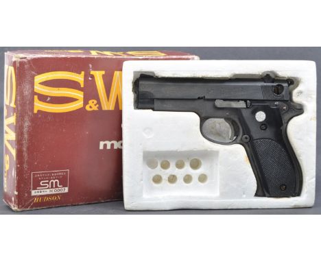 An original vintage Smith and Wesson made Model 41 9mm calibre blank firing pistol. The gun of heavy metal construction with 