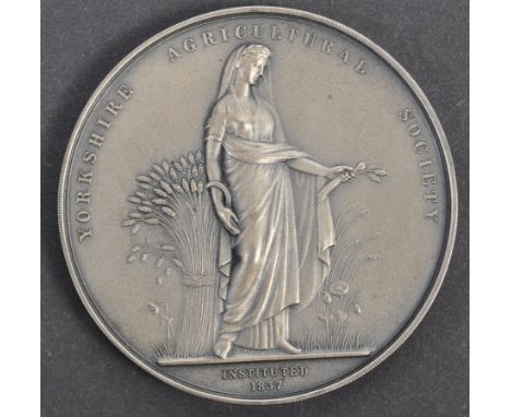 Collection of antique medallions - a vintage hallmarked silver medallion from the Yorkshire Agricultural Society awarded to o