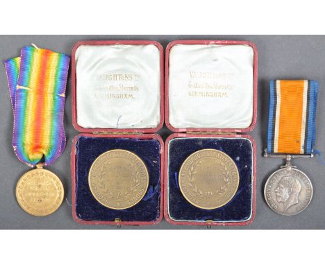 A WWI First World War medal pair awarded to one G-20231 Private George H. Durbin of the Royal Sussex Regiment, comprising his