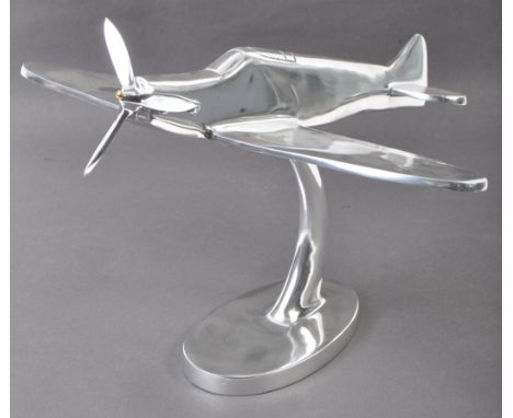 A large and impressive vintage 20th century chromed model of a WWII Second World War RAF Spitfire. The model larger than thos