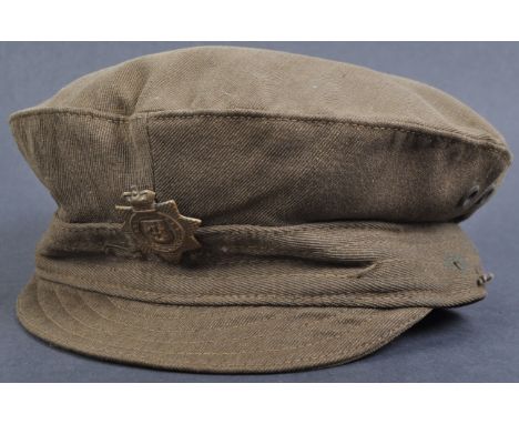 An original WWI First World War period British Army uniform Trench Cap. The cap of typical form, in green, complete with its 