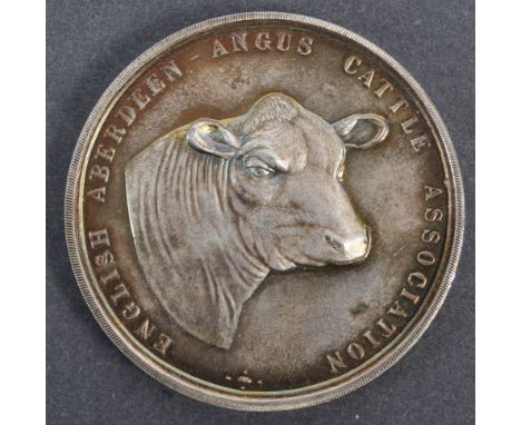 Collection of antique medallions - a vintage hallmarked silver medallion from the English Aberdeen Angus Cattle Association a