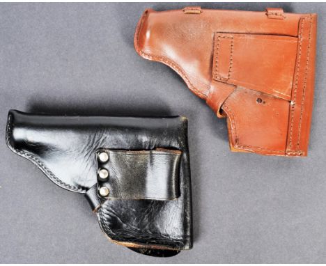 Two vintage believed German small sidearm pistol holsters in leather. The first in black leather - likely WWII Second World W