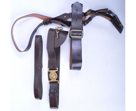 Two 20th Century British Army / Royal Marines Officer uniform sword belts. The belts both of brown leather construction, one 