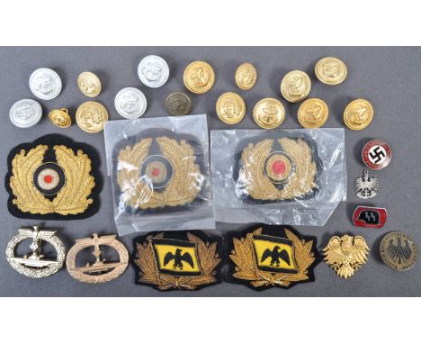 A collection of assorted WWII Second World War Third Reich Nazi German Kriegsmarine related cap badges and other related item