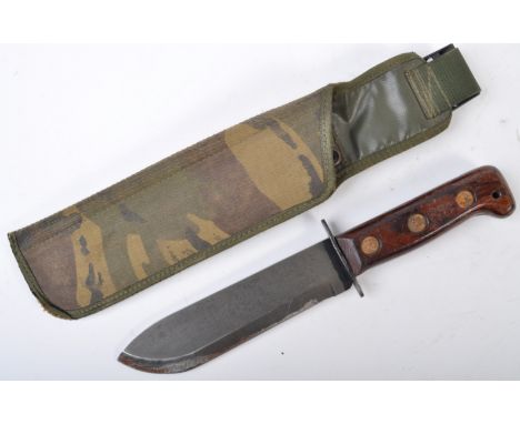 A 20th century 1982 dated Falklands War era British Army issue large survival knife. The knife with a single edged blade, wit