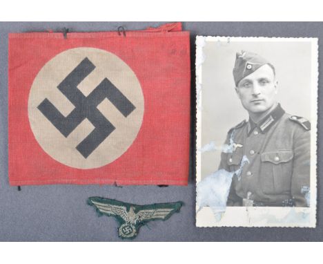An original WWII Second World War&nbsp;Third Reich Nazi German Party NSDAP members red cloth arm band. The armband of usual f