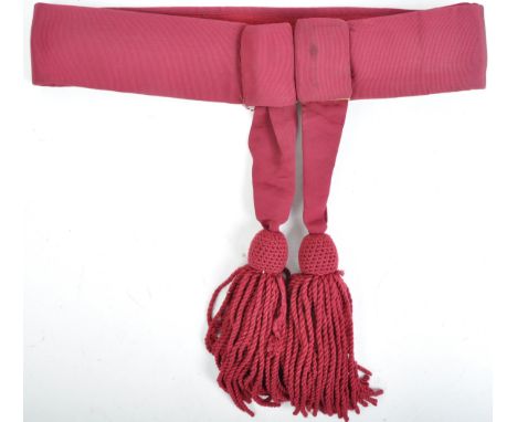 An original 20th Century British Army Officers ceremonial uniform dress sash. The crimson sash likely worn by a Lieutenant ra