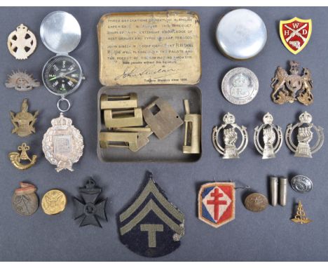 A collection of assorted WWII Second World War and other period military related items, to include; various cap badges, a Jap