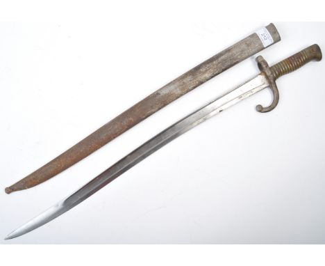 An original 19th Century antique French rifle sword bayonet. The sword having a hooked steel pommel with push release button,