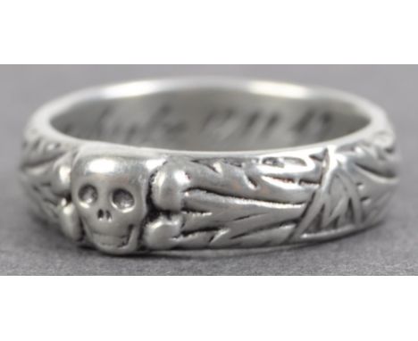 A WWII Second World War related Third Reich Nazi German white metal ring, featuring a skull and crossbones to the top. The in