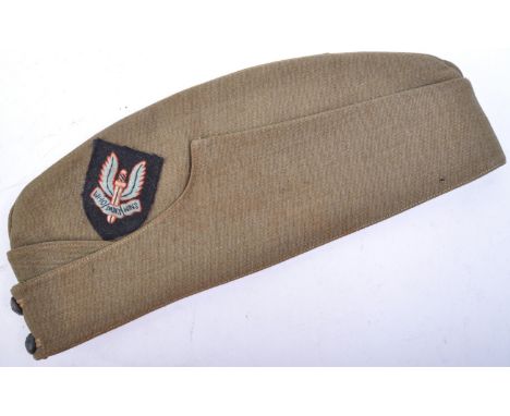 WWII Second World War Interest - a 20th century British Army forage / side cap in green, with an associated SAS ' Who Dares W
