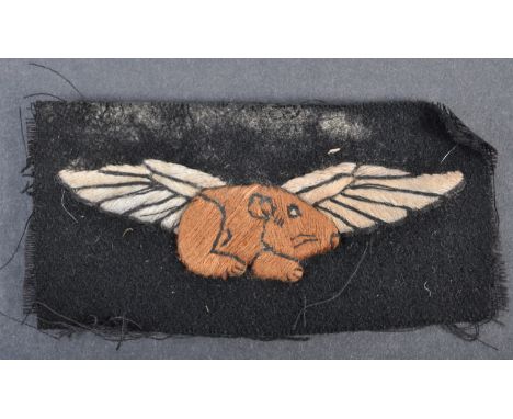 The Guinea Pig Club - A WWII Second World War type ' Guinea Pig Club ' cloth uniform patch. Black, with central brown and whi