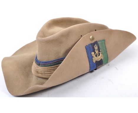 A WWII Second World War 1943 dated British Army uniform slouch hat - complete example, with chin strap and leather liner. Wit