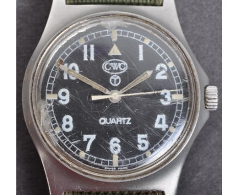 An original vintage British Military issue CWC ' Cabot Watch Co ' made soldiers wrist watch. A black dial with white Arabic n