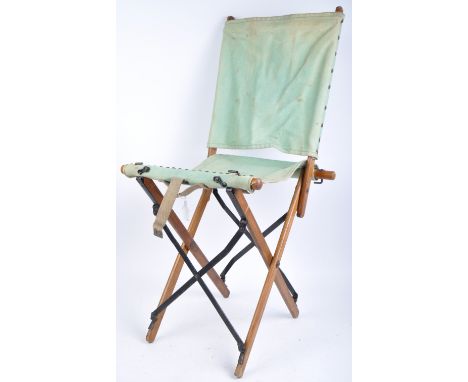 A WWII Second World War British Army issued folding / campaign chair. Wooden construction, with steel joints and canvas seat 