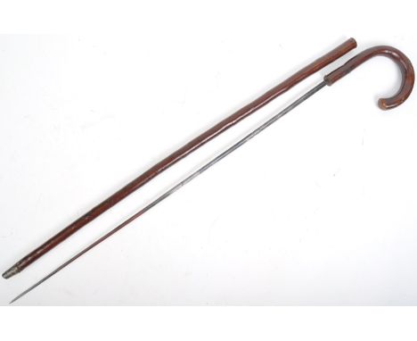 An early 19th Century Victorian Masonic sword stick / walking cane with concealed stiletto blade. The wooden hook shaped hand