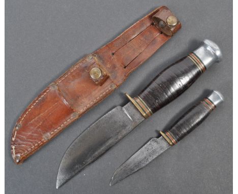 A 20th century William Rodgers made hunting / fighting knife / dagger, within its original leather scabbard. the knife with a