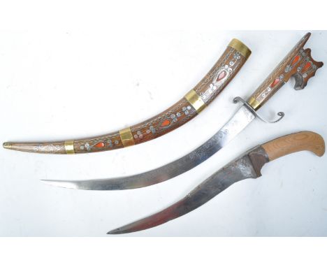 Two 20th century Middle Eastern ceremonial daggers / knives, comprising; an Indo-Persian / Indian Peshkabz dagger (AF) and an