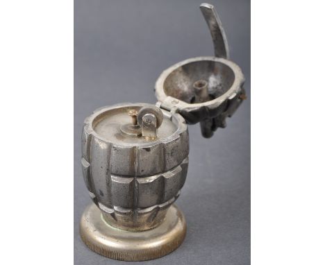 A WWII Second World War interest desktop cigarette lighter fashioned from a British Army hand grenade / Mills Bomb. The grena