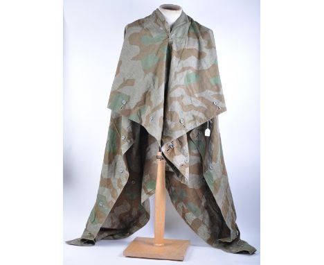 A WWII Second World War period believed Nazi German Army groundsheet / poncho / smock. Undated, and of two sided form. In a b