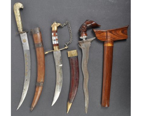 A collection of x3 assorted ethnic / tribal knives and daggers comprising an early 20th Century Malaysian Kris dagger with wa