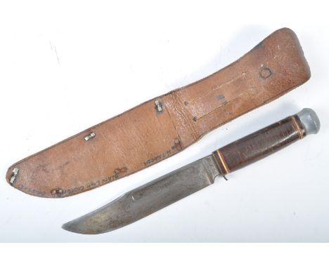 An original WWII Second World War period German ( possibly Afrika Korps ) K55 fixed blade knife. The knife having a flat stee