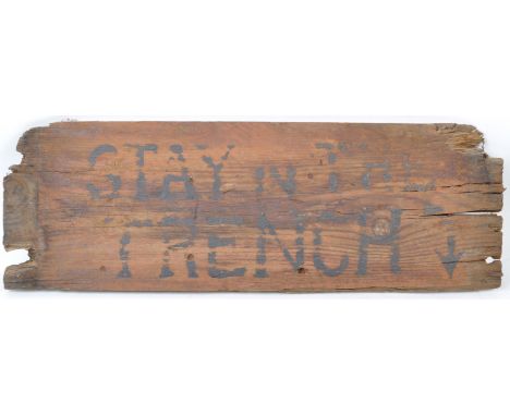 A WWI First World War related improvised trench sign ' Stay In Trench '. The sign of wooden plank construction (possibly a du