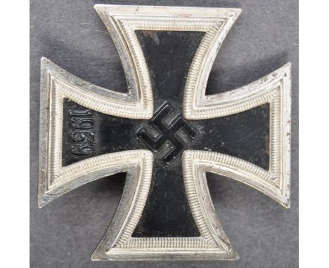 An original WWII Second World War Nazi German Third Reich Iron Cross First Class medal. Featuring Nazi Swastika to the centre